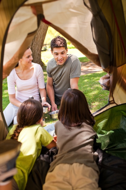 Happy family camping in the park