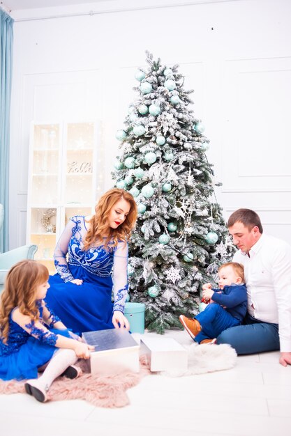 Happy family  in christmas interior before new year