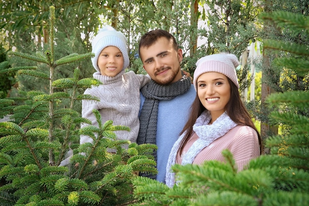 Happy family at Christmas tree market