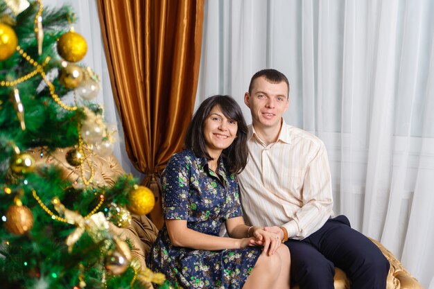 Happy family on Christmas tree 