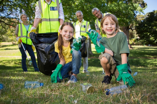 Happy family collecting rubbish 