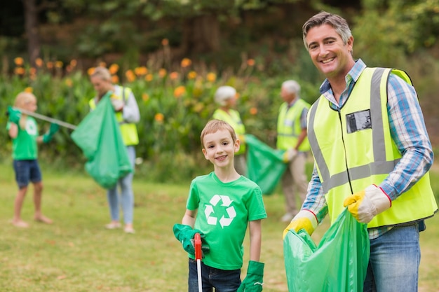 Happy family collecting rubbish 