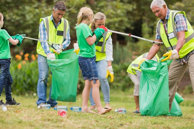 Happy family collecting rubbish 