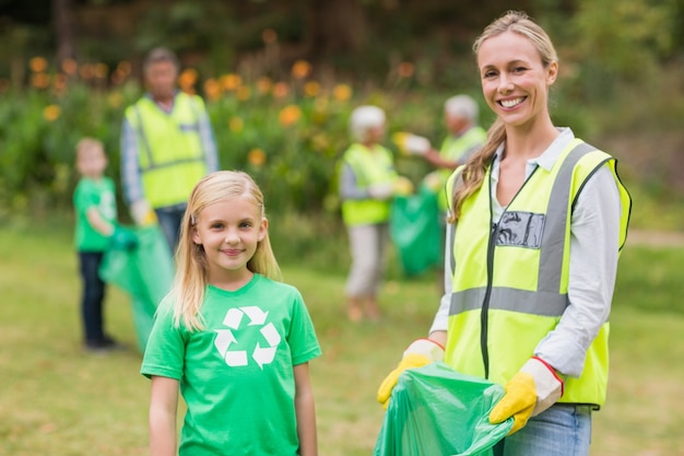 Happy family collecting rubbish 