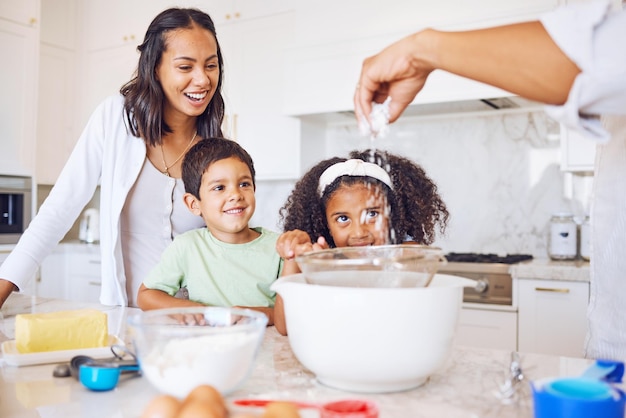 Happy family cooking kitchen and learning development or quality time relationship bonding Cheerful mom dad teaching breakfast recipes and kids baking together with support in family home