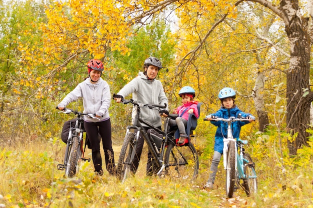 Happy family cycling outdoors