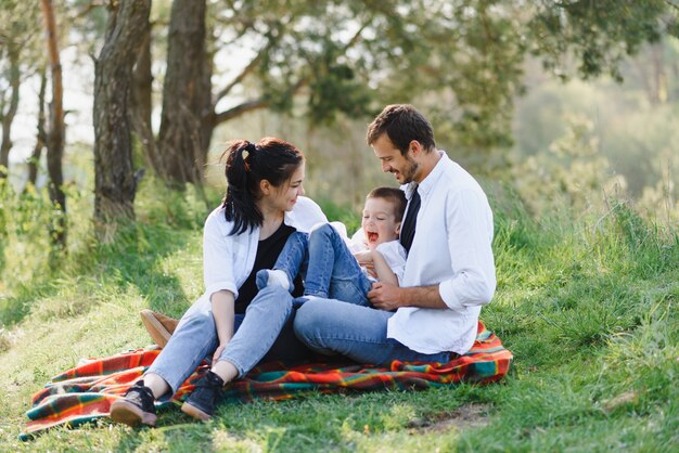 Happy family dad mom and son having fun and playing