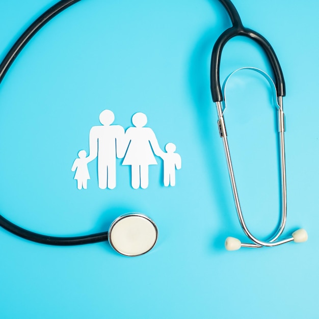 Happy Family day Stethoscope and paper shape cutout with Father Mother and Children international day of families Health wellness Life and Insurance concepts