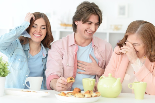 Happy family drinking tea together