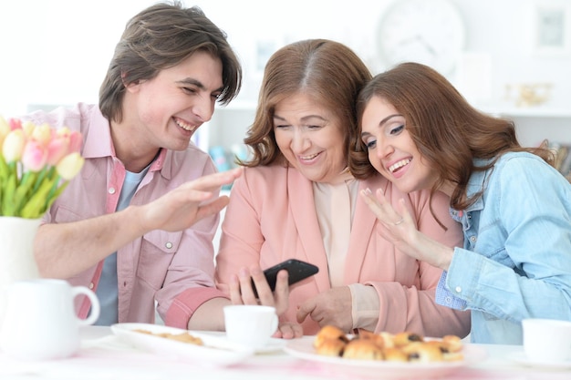 Happy family drinking tea together