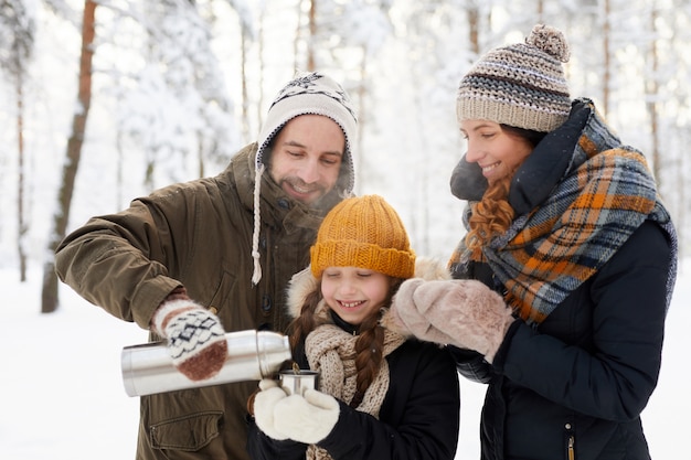 Happy Family Drinking Tea Winter