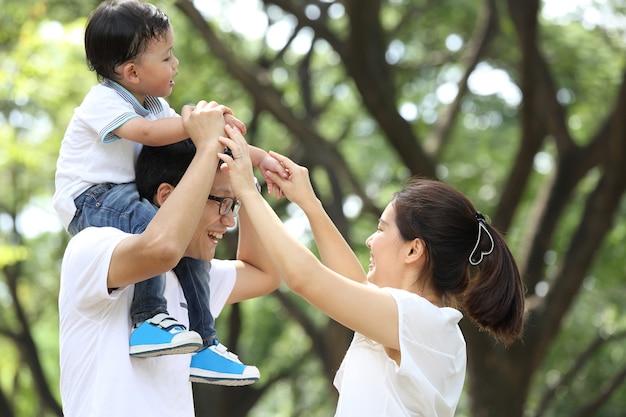 Happy Family enjoy and do activity together in Garden.