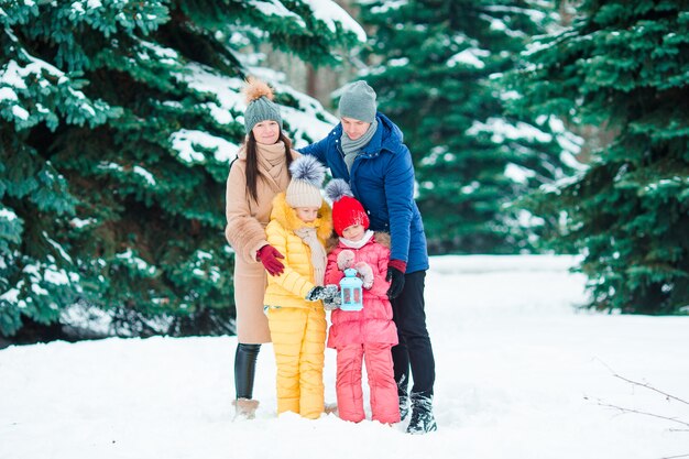 Happy family enjoy winter snowy day