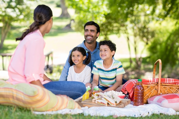 Happy family enjoying together in park