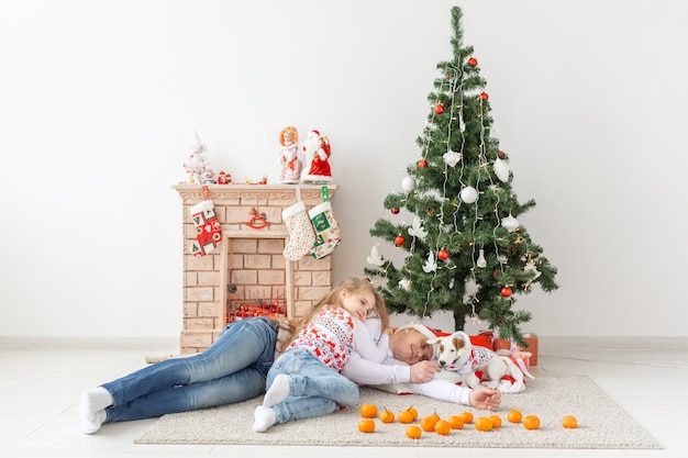 Happy family father and child at Christmas tree at home