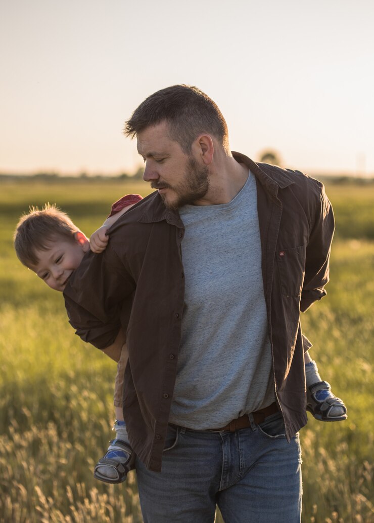 Happy family. Father and son playing and embracing the outdoors. Father's day