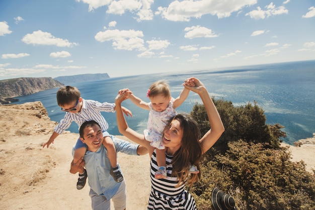 Happy family of four celebrating life