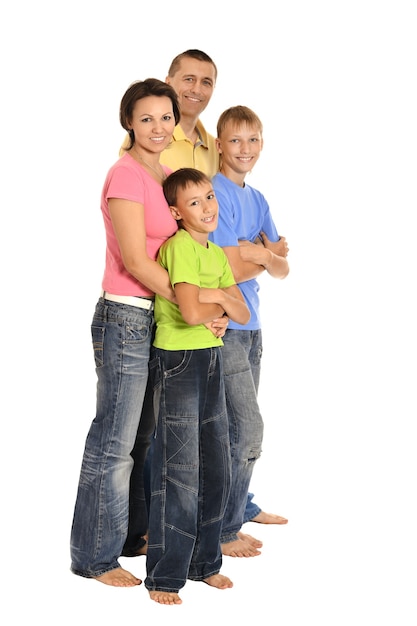 Happy family of four standing on white background