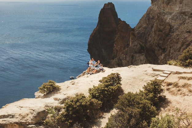 Happy family of four walking in the mountains. Family concept. Family trip.