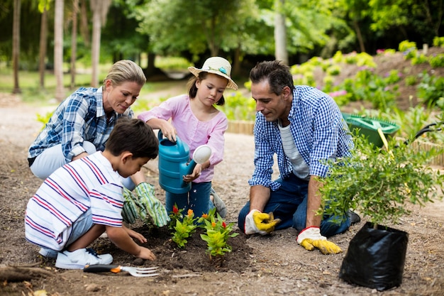 Happy family gardening together