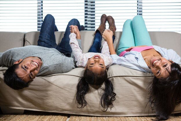 Happy family hanging upside down