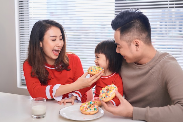 Happy family has breakfast in the morning