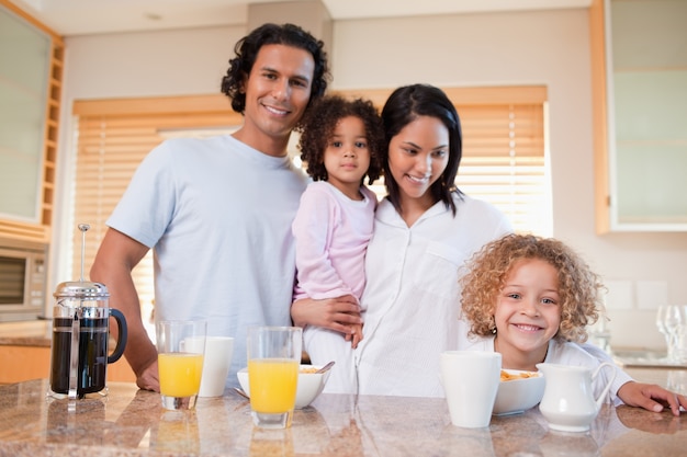 Happy family having breakfast in the kitchen together