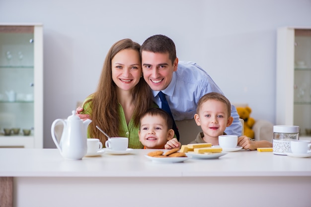 Happy family having breakfast together at home