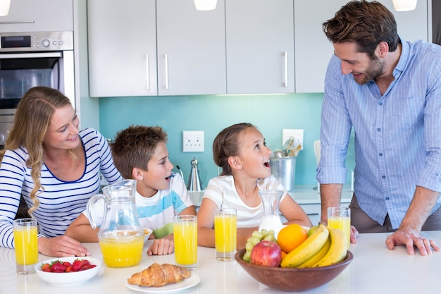 Happy family having breakfast together 