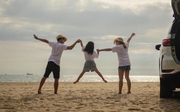 Happy family having fun on beach family travel on summer vacation