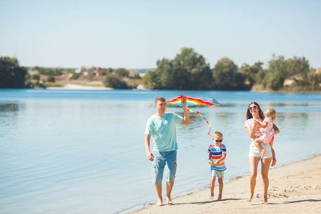 Happy family having fun on the beach.