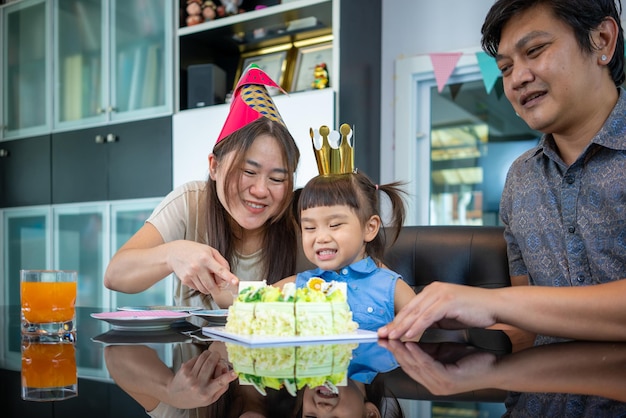 Happy family having fun at birthday party