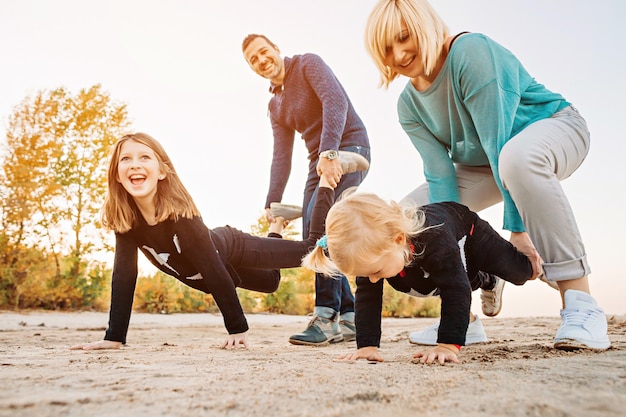 Happy family having fun by the river