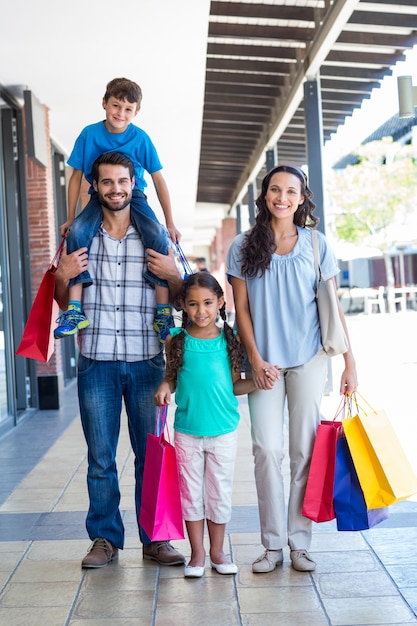 Happy family having fun in the mall