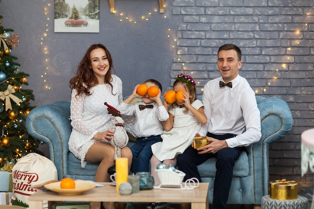 Happy Family Holding Christmas Gift