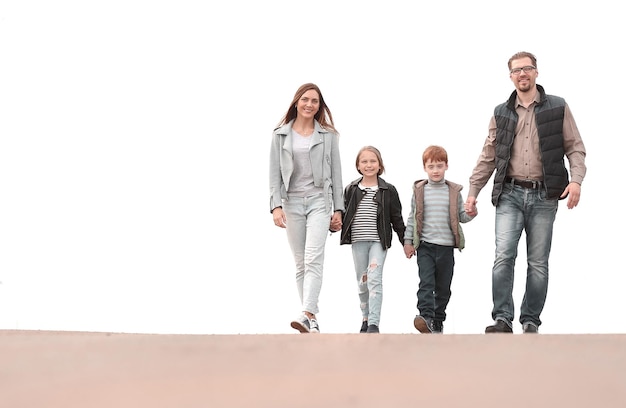 Photo happy family holding hands and walking