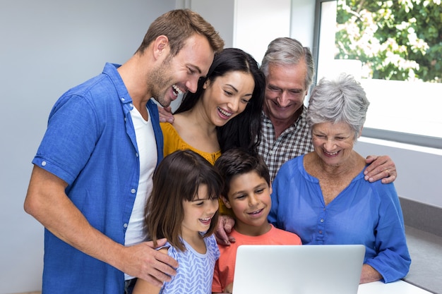 Happy family interacting using laptop