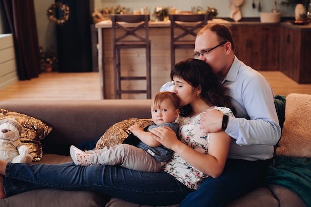 Happy family in the living room decorated for christmas.