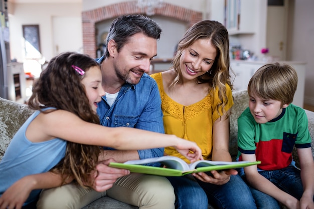 Happy family looking at a photo album