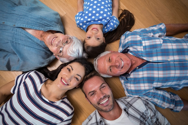 Happy family lying on floor