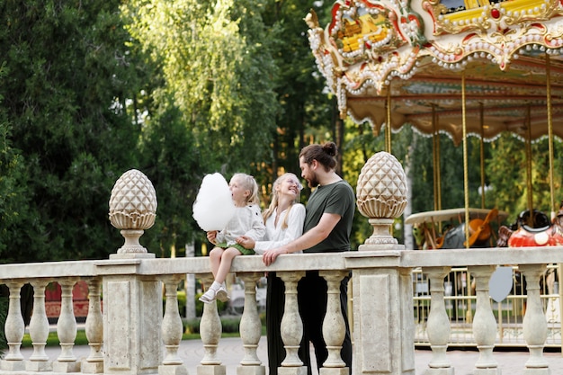 Happy family in the moonpark in the summer