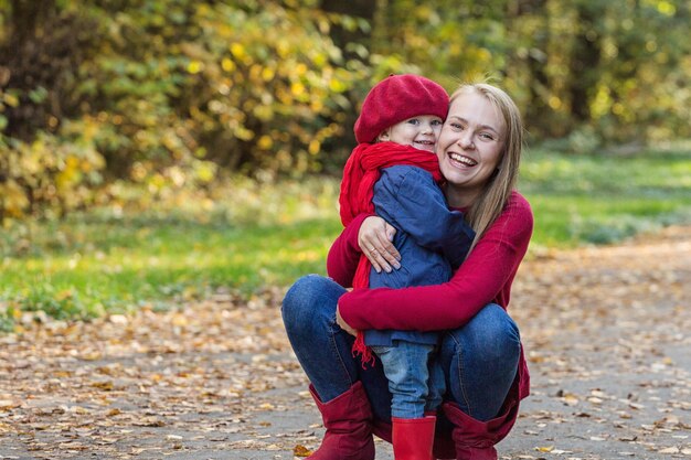 Happy family Mother and daughter spend time in the autumn park Laugh and play