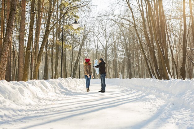 Happy family - Mother, father and child boy on a winter walk.