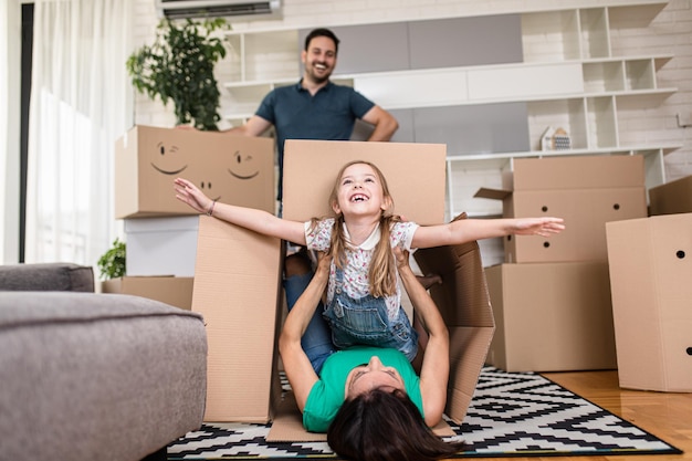 Happy family moving into their new home.