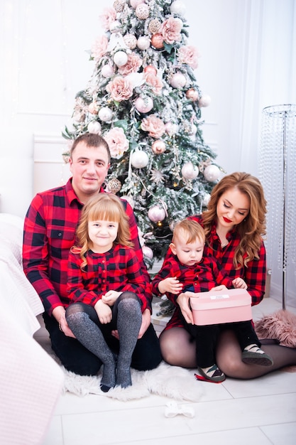 Happy family near christmas tree