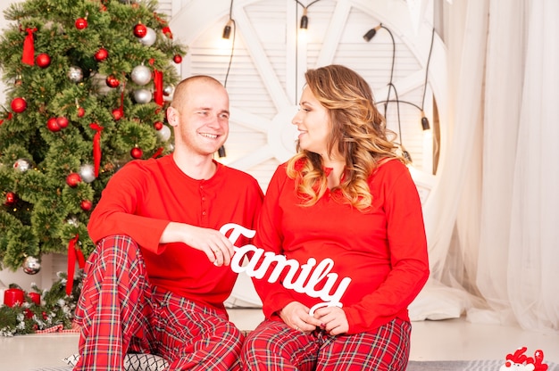 Happy family near christmas tree