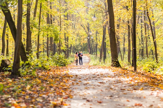 Happy family outdoor in autumn