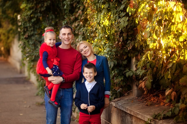 Happy family in the park in autumn