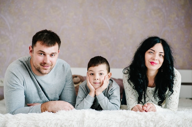 Happy family photo in bedroom