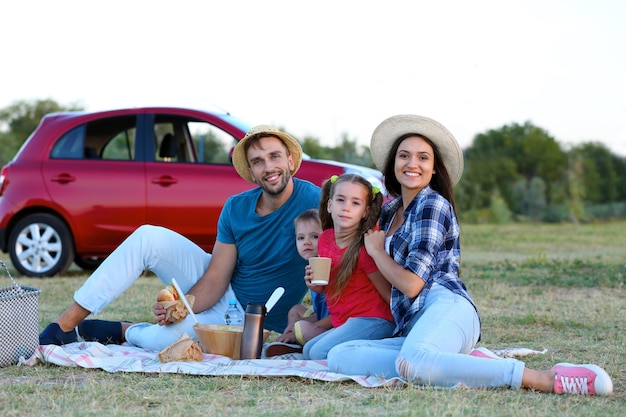 Happy family on picnic outdoors